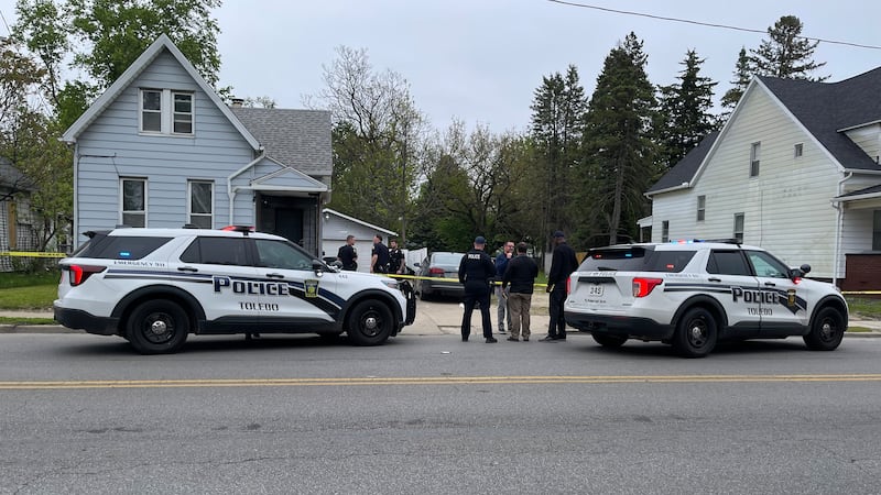 Toledo Police officers investigate a shooting on Nebraska Avenue in Toledo on May 12, 2026.