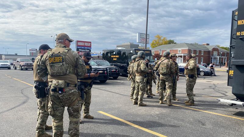 Law enforcement personnel arrive to the scene of an active shooter in Dearborn, Mich.,...