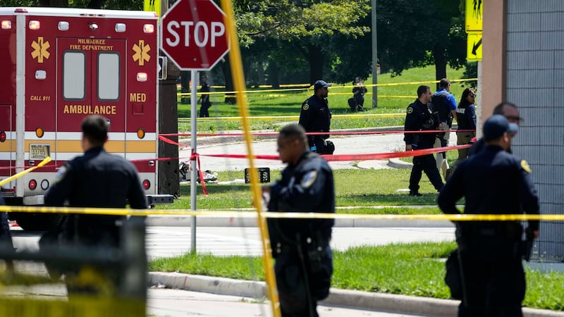 FILE - Police investigate a shooting near King Park during the second day of the 2024...