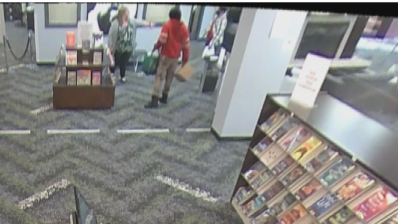 Surveillance footage from the Kent Branch Library in Toledo shows someone throwing a box of...